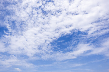 Wall Mural - clear blue sky background,clouds with background, Blue sky background with tiny clouds. White fluffy clouds in the blue sky. 