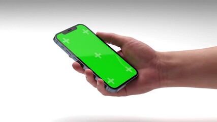 Hand holding a modern smartphone with a bright green screen and tracking markers on a clean background