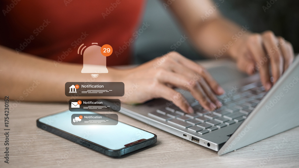 Push Notification Computer Mobile push notifications alert while woman typing on laptop ...