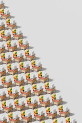 3d robots working at office desks with computers in a repetitive pattern
