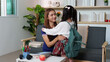 © itchaznong - Emotional farewell between mother and daughter before school