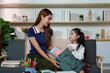 © itchaznong - Mother and daughter bonding over school preparations