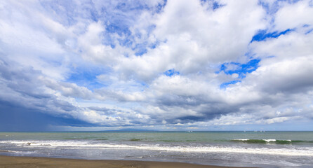 Wall Mural - The sky is cloudy and the ocean is calm