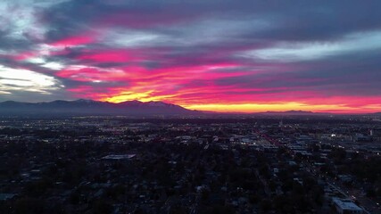 Wall Mural - Aerial Salt Lake City skyline with mountains at sunset