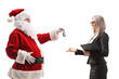 © Ljupco Smokovski - Santa claus giving car keys to a businesswoman