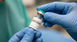 © MED - Hands in blue gloves holding a chemotherapy vial