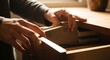 © Mr.atungs - Hands opening a wooden drawer to reveal books and documents, symbolizing organization and knowledge retrieval