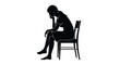 © nanda - A solitary woman's silhouette captured in a moment of deep thought and melancholy while seated on a chair, symbolizing introspection and sadness