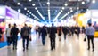© Kopi - Blurred shot of a crowded convention center with people walking past booths