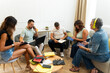 © Alfonso Soler - Adults collaborating on project in casual coworking space