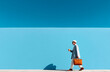 © aboutnuylove - stylish senior woman in hat and coat walking with coffee to go on blue background