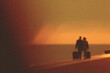 © Andrei - Silhouetted figures walk towards horizon during sunset, creating serene atmosphere