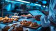 © Jed - Over-the-shoulder view of a bakery manager monitoring a National Dessert Day order surge on a tablet in a busy kitchen office