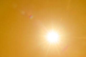 Wall Mural - Bright sun in orange sky during hot summer weather. Extremely high temperature