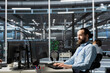© DC Studio - Data center admin running diagnostic scripts on computer, examining infrastructure. Server room IT expert using PC to evaluate performance metrics, running tests to maintain system stability
