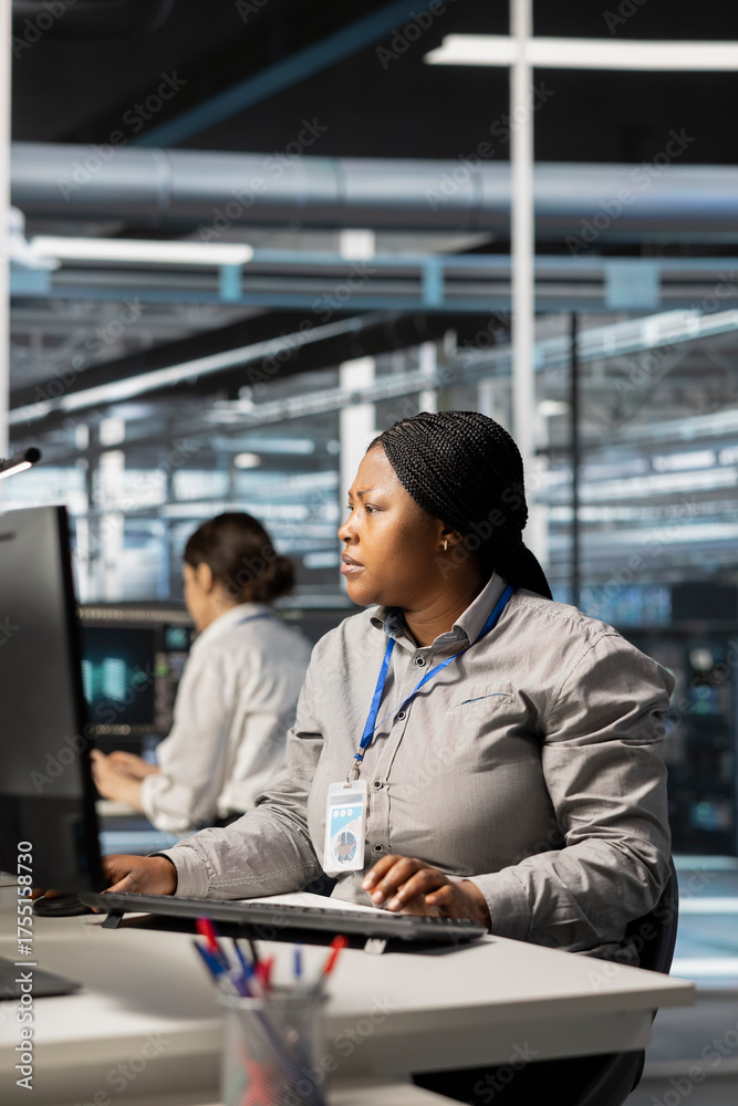Data center software developer running diagnostic scripts, examining ...