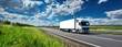 © Studio Nova - The truck driving on a rural highway under dramatic blue sky and clouds