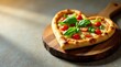 © napak - Heart-shaped pizza with fresh basil and cherry tomatoes, artistically arranged on a rustic wooden board, bathed in warm sunlight.