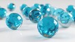 © phy - A group of blue and transparent spheres scattered on a white surface with a reflective surface.