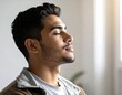 © Enak - Portrait of a young man with dark hair and closed eyes, enjoying inner peace