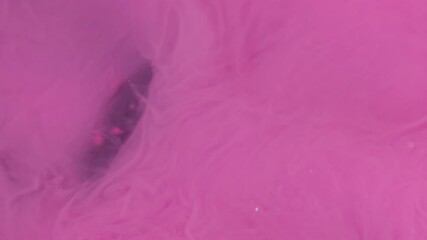 Wall Mural - Cloud blend. Dye spread. Bright color pink paint explosion flow. Art fume wave spray abstract blur black sparkling water background.