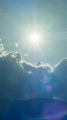 Wall Mural - Beautiful summer day sky with fluffy white clouds time lapse in bright blue atmosphere.