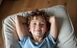 © nian - Top view of boy relaxing during vacation at home. High quality