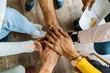 © BusinessClass by W61 - Close-up of business team stacking hands