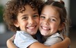 © Michael - Close-up of siblings sharing a hug with smiling faces. High quality