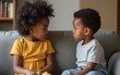 © James - Angry stubborn african preschool girl sister and offended little boy brother ignoring each other sitting on couch feel jealous avoiding talk, 2 children conflict, siblings rivalry bad relationship