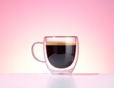 Black coffee in clear mug, pink gradient background