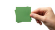 © MDHERON - Hand holding green paper square against black background