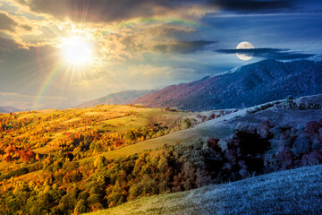 Wall Mural - mountain landscape on autumn equinox. day and night time change concept. beautiful view with trees in colorful foliage. picturesque rural place in alps with sun and moon at twilight. countryside scene