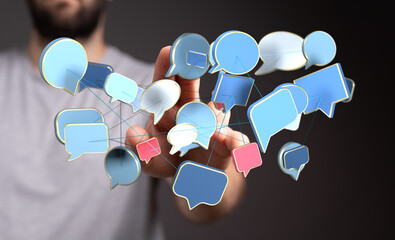 A person reaching out to a network of colorful speech bubbles, representing communication, social media, connection and dialogue.