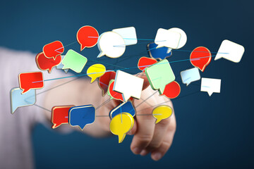 Wall Mural - Conceptual image of hand with connected speech bubbles, representing communication, social media, networking and sharing ideas.