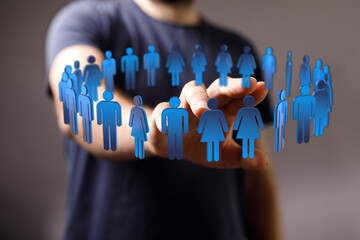 Wall Mural - Conceptual image of human figures and a hand, symbolizing connection, network, teamwork, community, and technology. Perfect for business and soc