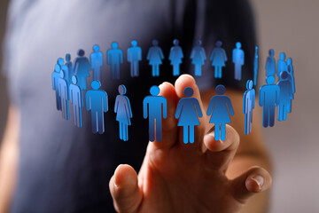 Wall Mural - Hand touching digital human icons in circle, symbolizing teamwork, connection and communication. Illustration representing people, technology an