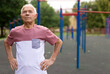 © caftor - Portrait of sporty grandfather on playground in summer park
