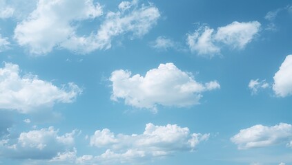 Wall Mural - Puffy white clouds drifting across a clear azure sky, evoking a calm and invigorating scene for weather and nature concepts