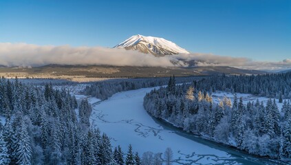 Wall Mural - Scenic snowy landscape featuring a frozen river and mountain under a clear blue sky.