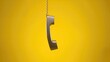 © CreativeBro - A digital phone handset suspended against a bright yellow backdrop with room for text