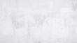 © MetaPixel - Retro style wall with rough white cement or stone texture as a vintage background pattern. Conceptual banner featuring grunge construction material.
