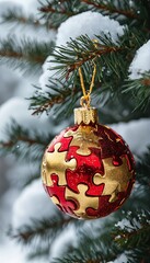 Wall Mural - a vibrant red and gold puzzle-piece ornament hangs delicately from a snow-covered evergreen branch.
