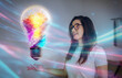 © Rendara Studio - Woman interacting with colorful glowing lightbulb symbolizing digital creativity