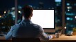© Johannes - over shoulder view at business man using desktop computer looking at mock up white blank screen monitor for advertising working late e learning online on website watching webinar at home office no lo