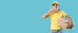 © Pixel-Shot - Female courier with pizza boxes showing 'call me' gesture on blue background