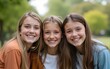 © Nancy - Close up of pre-teen friends in a park smiling to camera. High quality