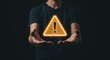 © Kind Bee Studio - Man Holding Glowing Warning Sign With Exclamation Mark Symbol Above Open Hands in Dark Background