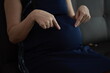 © Wiparat - Closeup of a pregnant belly, hands pregnancy