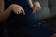 © Wiparat - Closeup of a pregnant belly, hands pregnancy